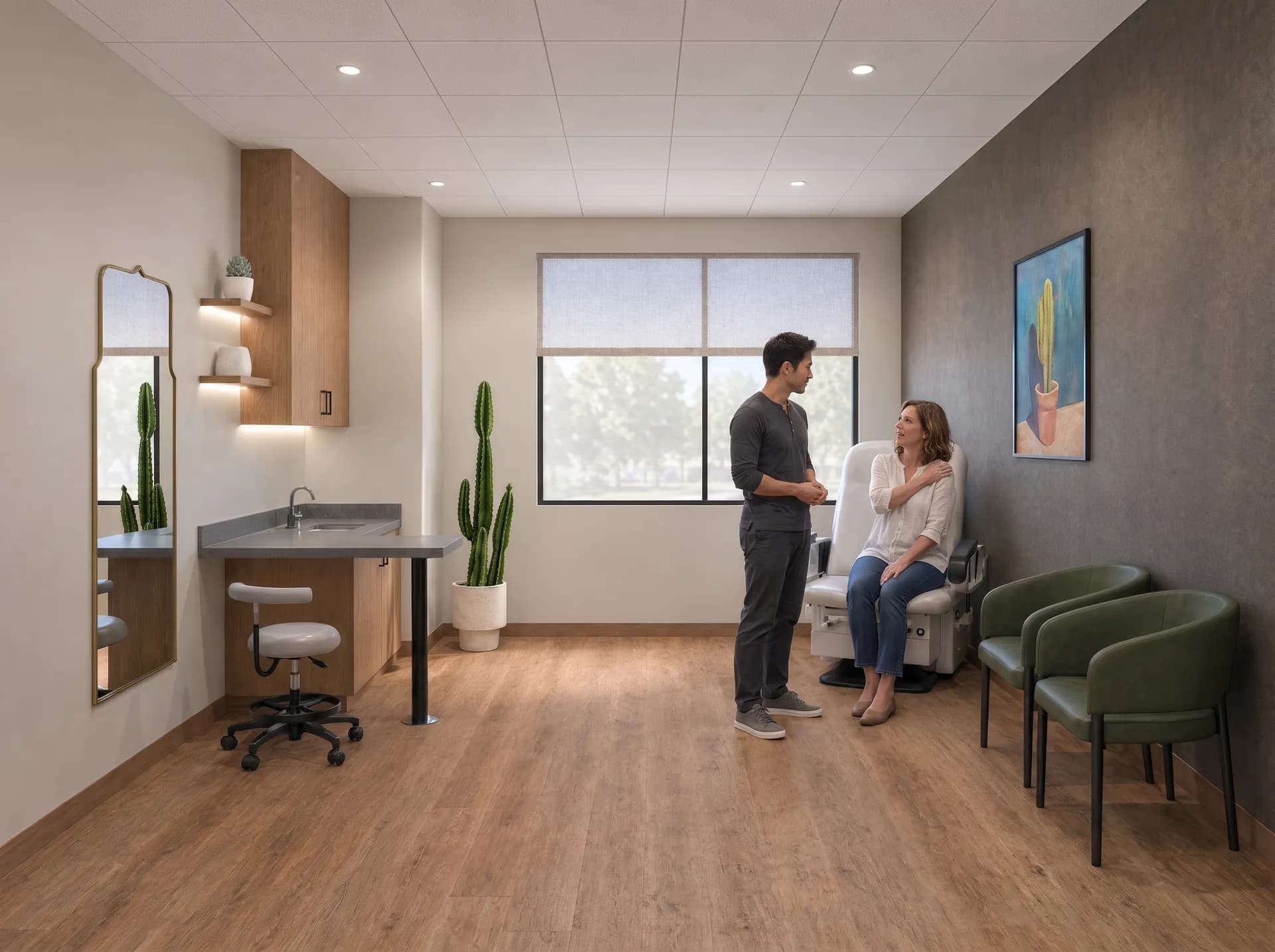 An acupuncturist listening to a patient describe a sore shoulder in a treatment suite at Alta Medical