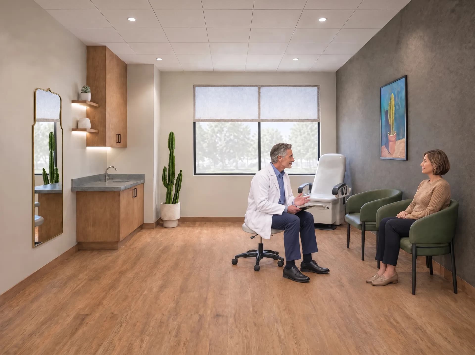 A physician and a patient talking through a treatment plan in a treatment suite at Alta Medical