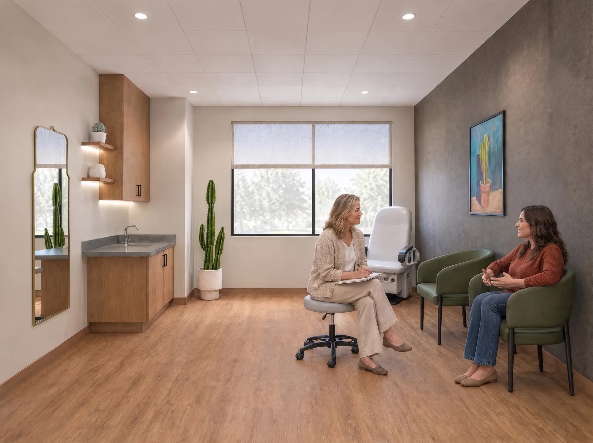 A naturopathic doctor listening to a patient during a long intake in a treatment suite at Alta Medical
